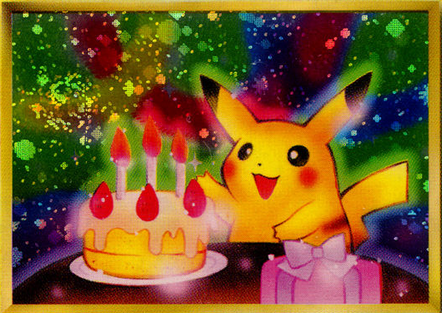 Pikachu in front of a birthday cake